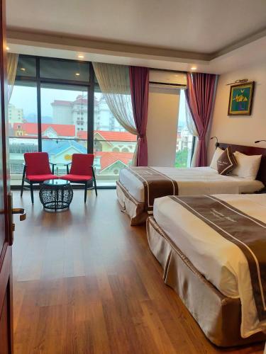 Ένα ή περισσότερα κρεβάτια σε δωμάτιο στο Camellia Hotel
