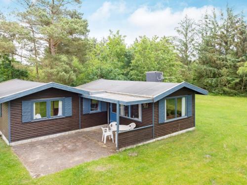 a tiny house with a solar roof on a yard at 5 person holiday home in Højslev-By Traum in Bøstrup