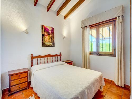 Ένα ή περισσότερα κρεβάτια σε δωμάτιο στο Sunny Family Villa, Calpe