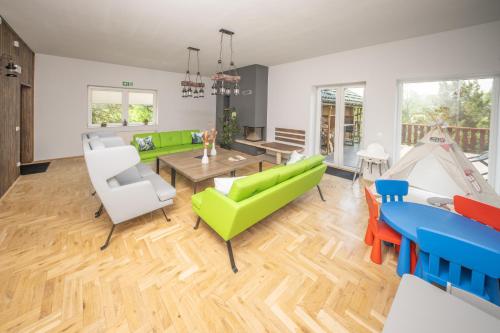 a living room with furniture and a tent at VITA MINERALIS Szczawnica in Szczawnica