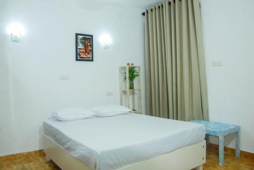 Кровать или кровати в номере Story House