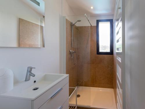 a white bathroom with a sink and a shower at Villa in Malaucène with Mont Ventoux Views in Malaucène