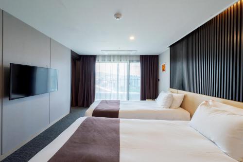 Katil atau katil-katil dalam bilik di M83 Jackson Hotel