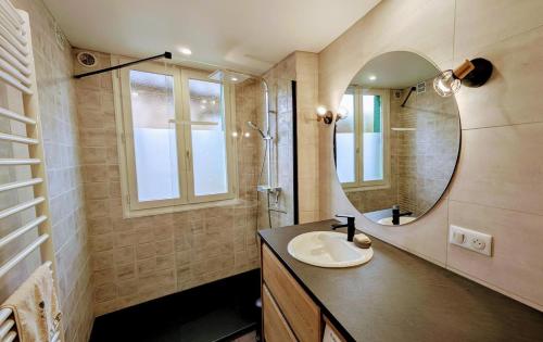 a bathroom with a sink and a mirror at Chez lucie in Jabreilles-les-Bordes