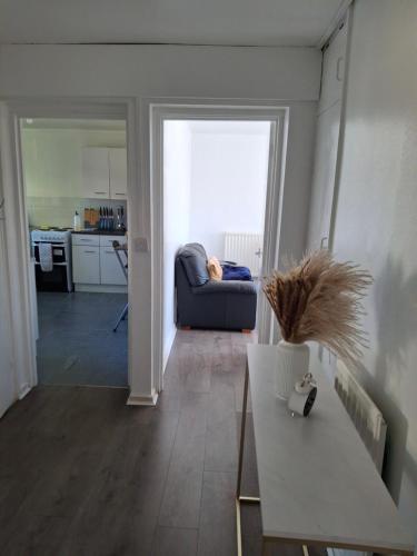 a living room with a couch and a table at Toni's Hub - 2 bed City Centre Apartment in Derby