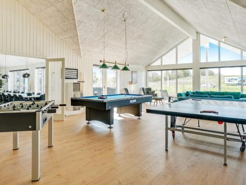 a large room with two billiard tables in it at 26 person holiday home in Grenaa in Grenå