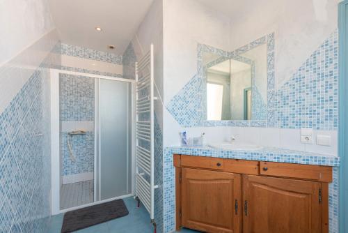 a bathroom with a sink and a mirror at Maison Zoé- Haute pyrenees in Saint-Laurent-de-Neste