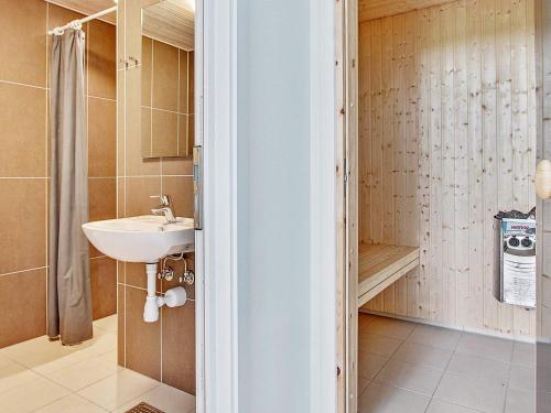 a bathroom with a sink and a shower at Luxury Pool Retreat - By Traum Ferienwohnungen in Vejby