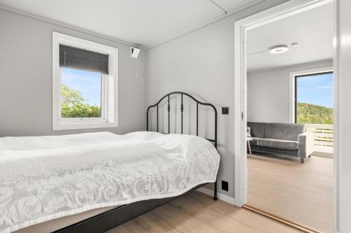 a bedroom with a bed and a window at Sandefjord 1 bedroom kitchen and bathroom - Non smoking in Sandefjord