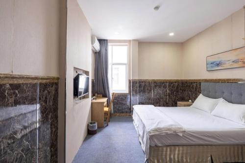 Cama o camas de una habitación en Tân Quý Đô Hotel
