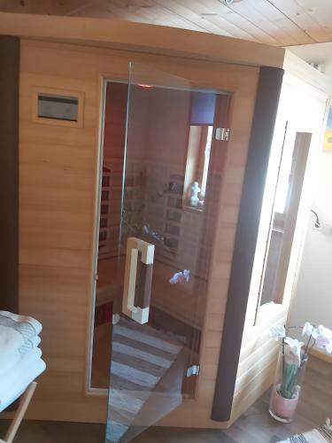 a glass door of a room with a stairway at Haus Vögel in Sibratsgfäll