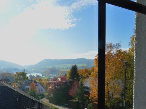 a view from the window of a house at Lakeview Stay in Vielsalm in Vielsalm