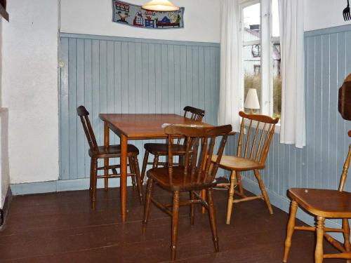 a dining room with a table and chairs at 5 person holiday home in KALVSVIK in Kalvsvik