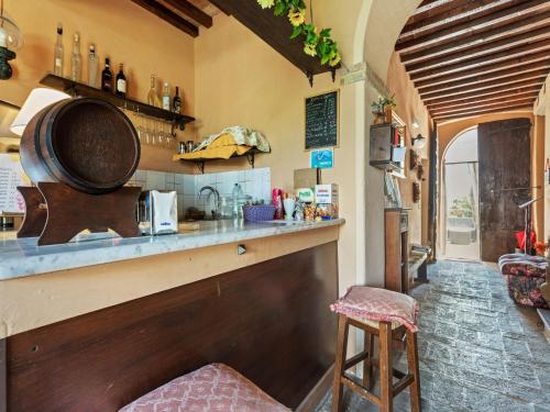 a kitchen with a counter and a bar at Rustic Holiday Home in Città di Castello with Swimming Pool in Città di Castello