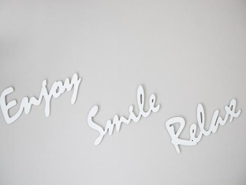 a white wall with the words happy anniversary and raisin at Beautiful Apartment in Callantsoog near Beach in Callantsoog