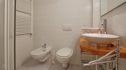 a bathroom with a toilet and a sink at Italianway - Torno in Torno