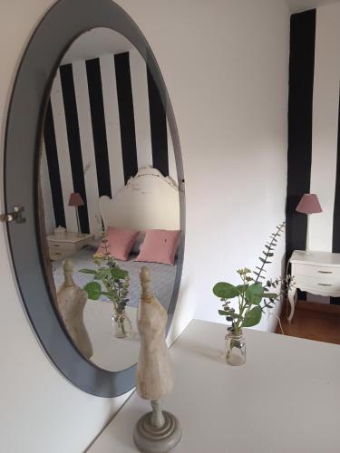 a mirror on top of a white table in a room at Casa Elsa in Puerto del Rosario