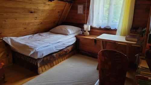 Postel nebo postele na pokoji v ubytování Wilczkiewiczówka - Bieszczadzki Azyl