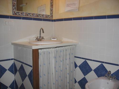 a bathroom with a sink and a mirror at Beautiful holiday home in Laroya with shared pool in Laroya