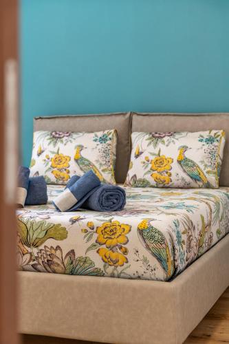 a couch with pillows and a blanket on it at The Silk House in Como