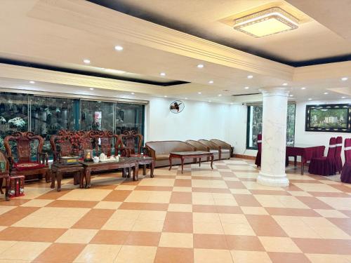 a lobby with chairs and tables in a room at Sky Garden Hotel Tam Dao Phu Tho in Tam Ðảo