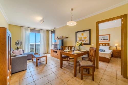 a living room with a couch and a table at Sotavento Horizon Views Suite in La Tejita