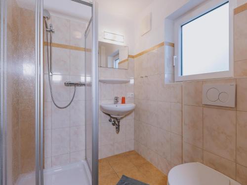 a bathroom with a shower and a sink and a toilet at holiday home, Fusch an der Glocknerstraße in Fusch an der Glocknerstraße