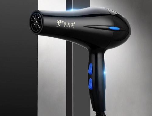 a black hairdryer sitting on a stand at RED LUXE HAVEN Comfy stay, Netflix and Fast WiFi Ready in Manila