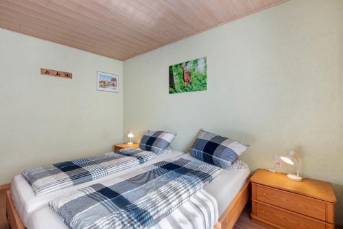 a bedroom with a bed with two pillows on it at Apartment Alte Poststation in Wehr