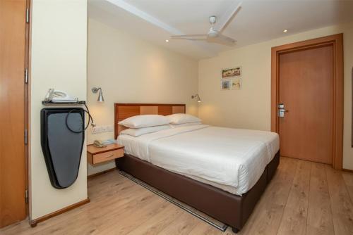 a bedroom with a bed and a tv in it at Best Western Nairobi Upper Hill in Nairobi