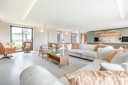 a living room with white couches and chairs at 5 Bed in Marwood oc-e32631 in Marwood