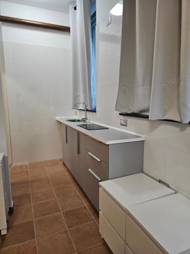 a small kitchen with a sink and a counter at La Magia Lucana in Colobraro
