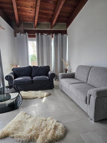 a living room with a couch and a rug at La Magia Lucana in Colobraro
