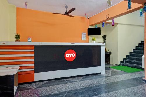 a stage with a tv and stairs in a room at Hotel O Sai Inn in Chinchiwad