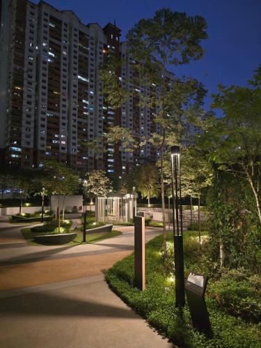 a park at night with a building in the background at Comfy Damansara PJ Condo 3BR 2Carpark in Petaling Jaya