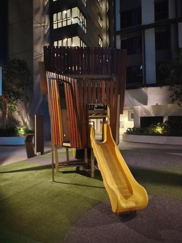 a playground with a yellow slide in a building at Comfy Damansara PJ Condo 3BR 2Carpark in Petaling Jaya