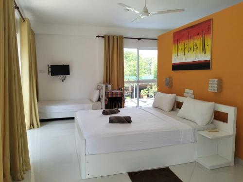 Postel nebo postele na pokoji v ubytování Hotel Good Life Unawatuna