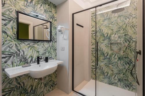 a bathroom with a sink and a shower at Dimora Borgo Antico Lucia in Ascea