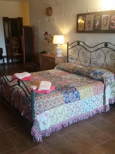 Ένα ή περισσότερα κρεβάτια σε δωμάτιο στο B&B La Nicchiarica