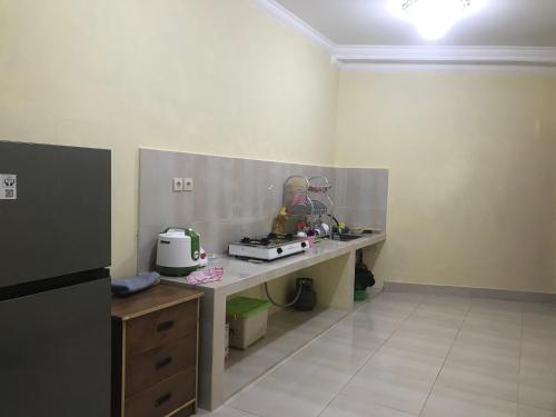 a kitchen with a counter with a appliance on it at Lahar Villa Lombok in Masbagik