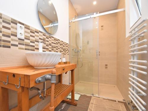 a bathroom with a sink and a shower at Relaxing Escape with Terrace in Schönbrunn