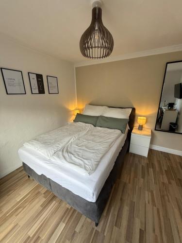a bedroom with a large bed in a room at Zentrale FeWo mit Terrasse und Weinbergblick in Bad Neuenahr-Ahrweiler