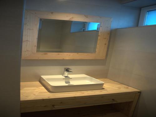 a bathroom with a white sink and a mirror at Apartment in Untertauern near Obertauern Skiing in Untertauern