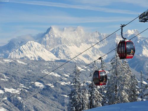 two gondolas on a ski lift in the mountains at Apartment in Untertauern near Obertauern Skiing in Untertauern