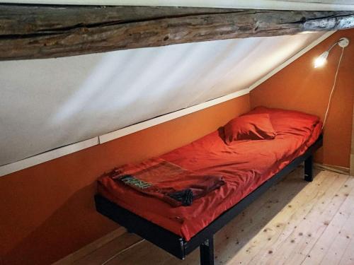 a small bed in the corner of a room at 6 person holiday home in HENÅN in Henån