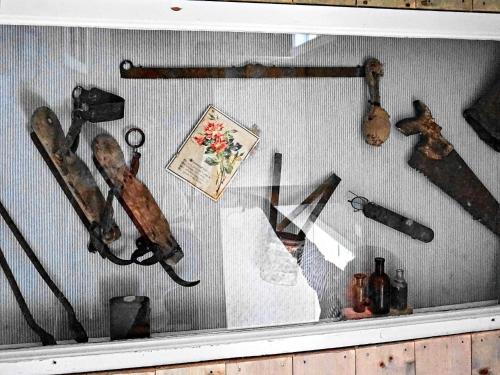 a display case with various weapons and other artifacts at 6 person holiday home in HENÅN in Henån