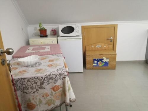 Ένα ή περισσότερα κρεβάτια σε δωμάτιο στο Águas Furtadas Mário Fanha