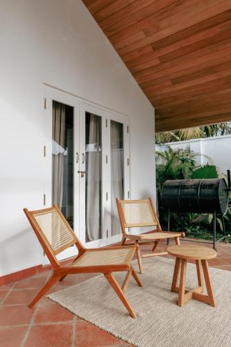 two chairs and a table on a patio at 3 Bed Private Villa With Pool, 250m To The Beach in Ahangama