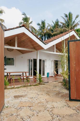 a house with a picnic table in front of it at 3 Bed Private Villa With Pool, 250m To The Beach in Ahangama