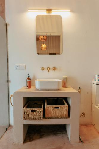 a bathroom with a sink and a mirror at 3 Bed Private Villa With Pool, 250m To The Beach in Ahangama